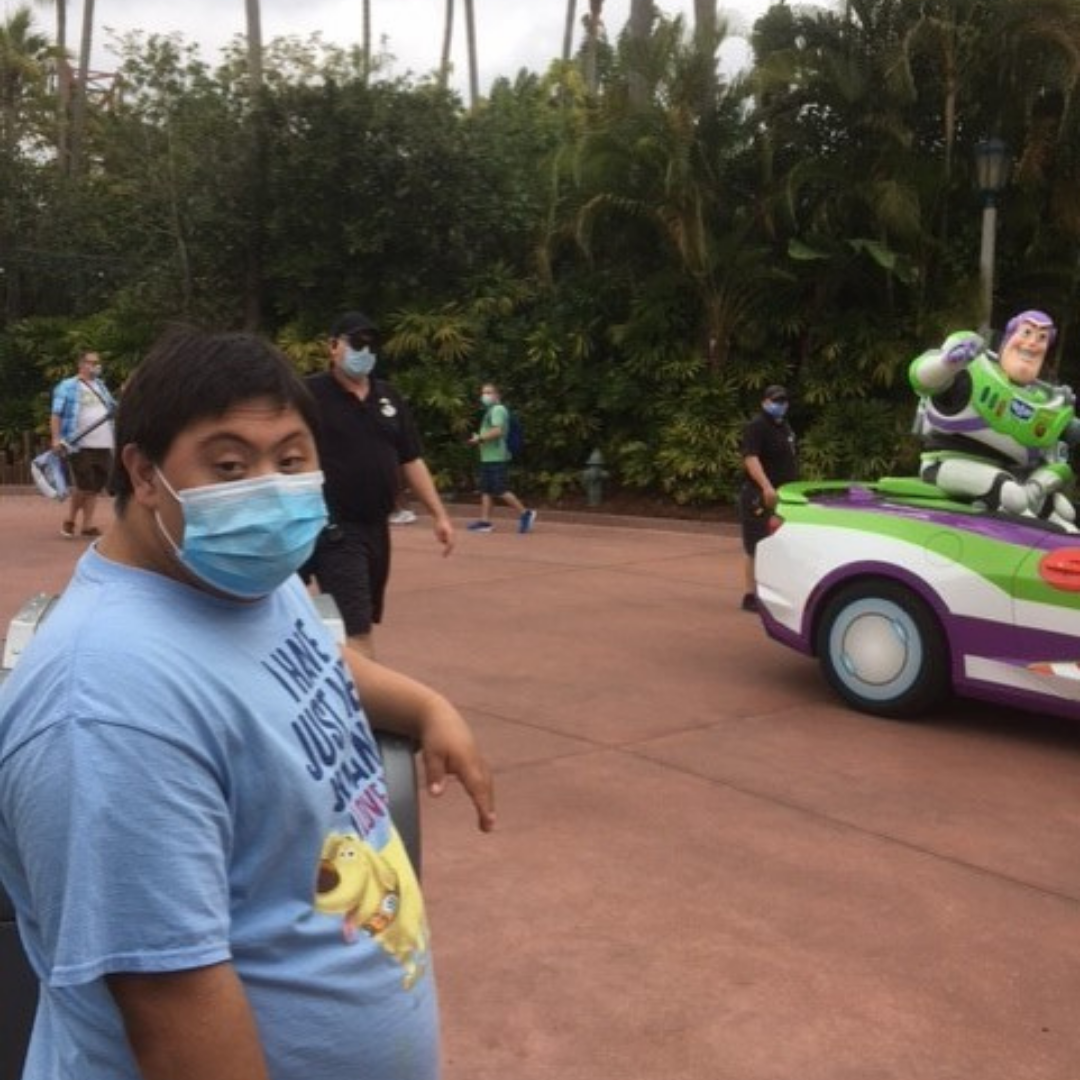 Teen boy with Buzz Lightyear at Disney