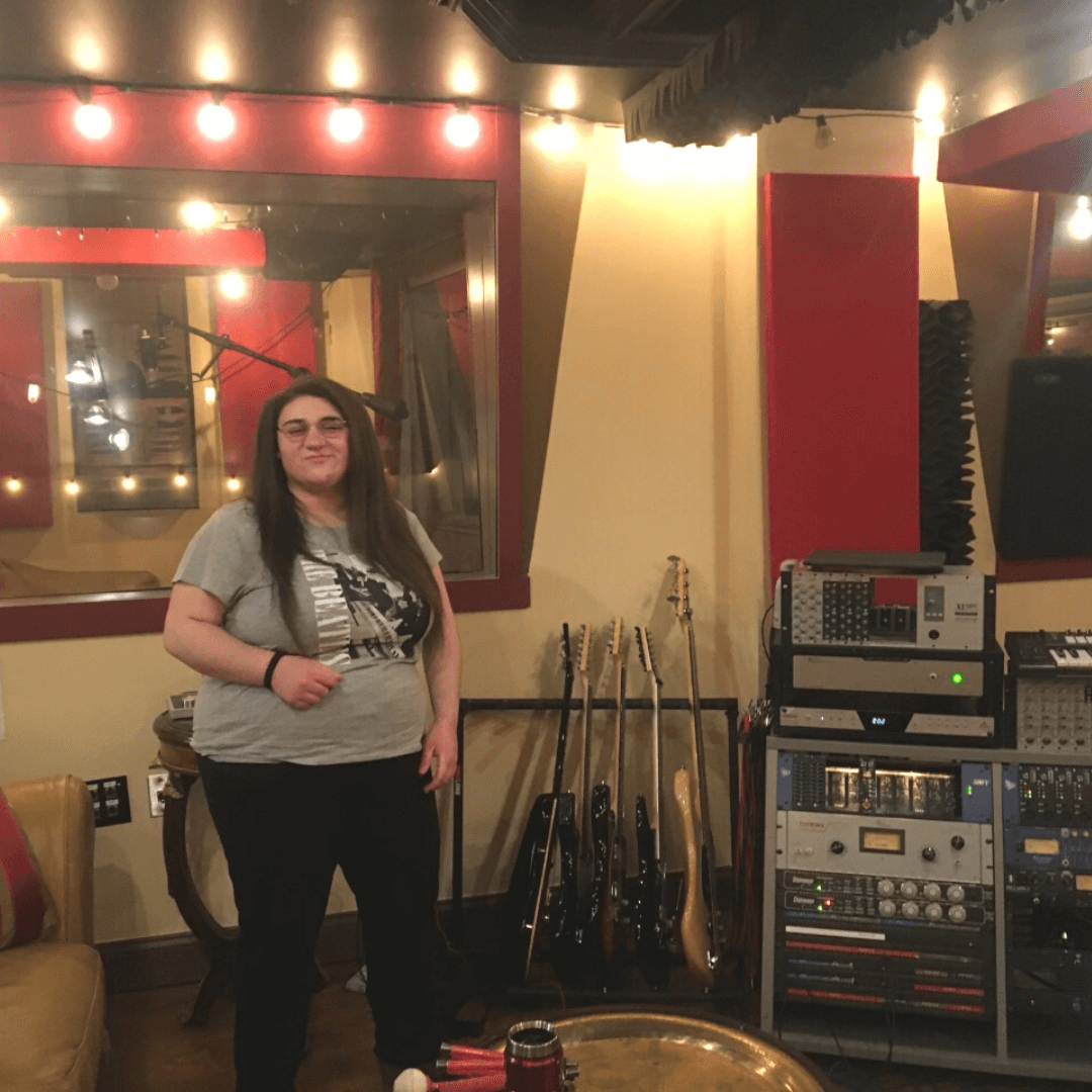 Teen girl tours music studio