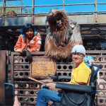 Teenage boy with epilepsy posing with at Disney World