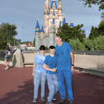 Joshua and his family at Magic Kingdom